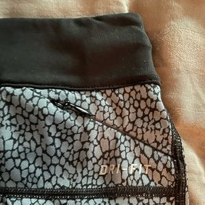 Nike running dry-fit capri pants with zipper.